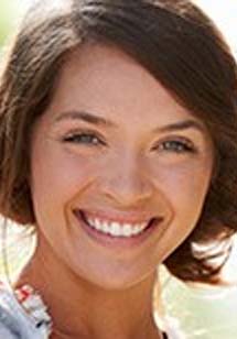 Smiling woman with short brown hair