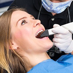 dentist checking a patients teeth