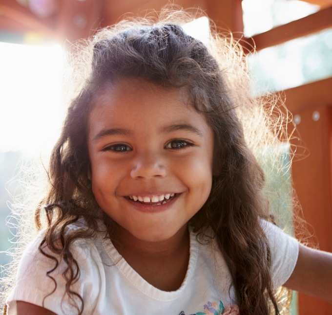 Little girl in white shirt smiling
