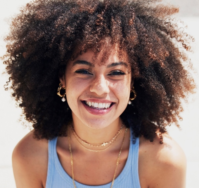 Woman smiling after cosmetic dentistry in Albuquerque