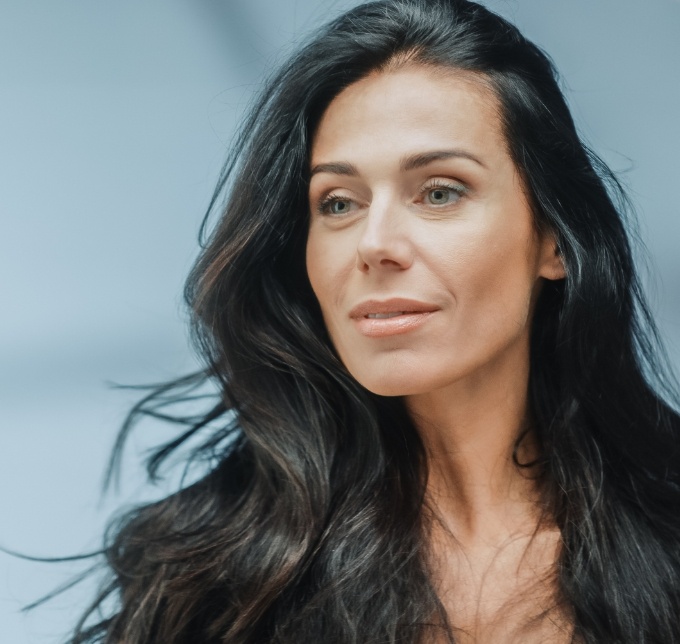 Woman with long hair smiling