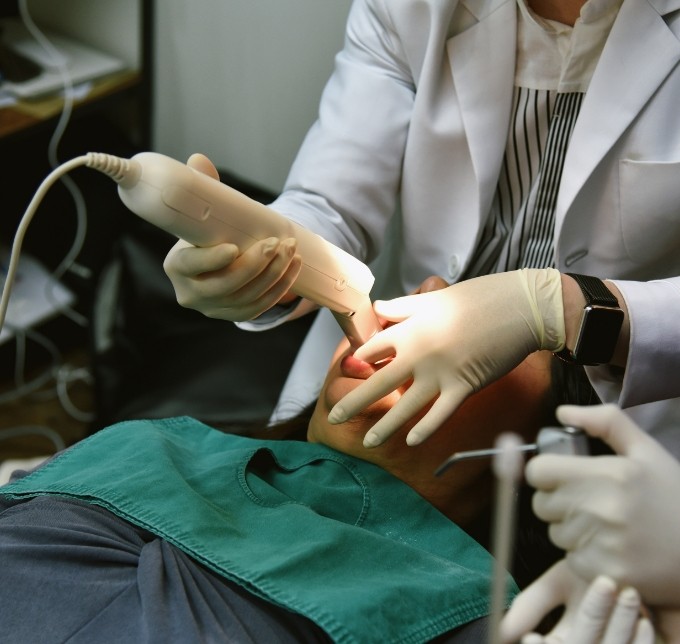 Dentist taking a patients digital impressions