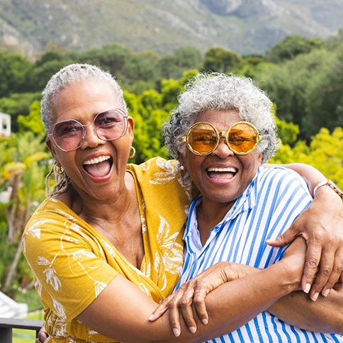 Two women smiling and laughing together