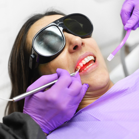 Patient receive laser gum disease treatment