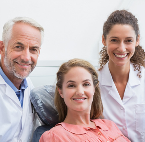 Female patient smiling after gum disease treatment