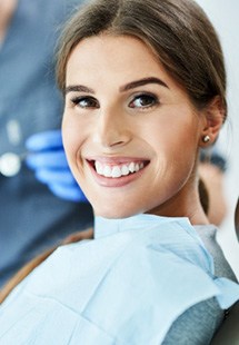 Patient putting on their Invisalign