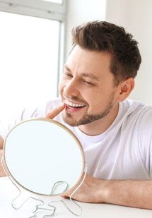 Patient putting on their Invisalign