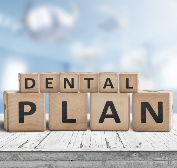Wooden blocks spelling out the words dental plan