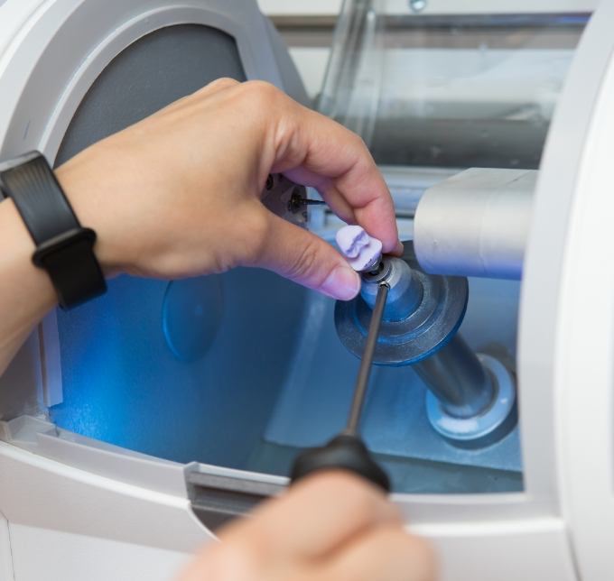 Working on a same day dental crown in a CEREC machine