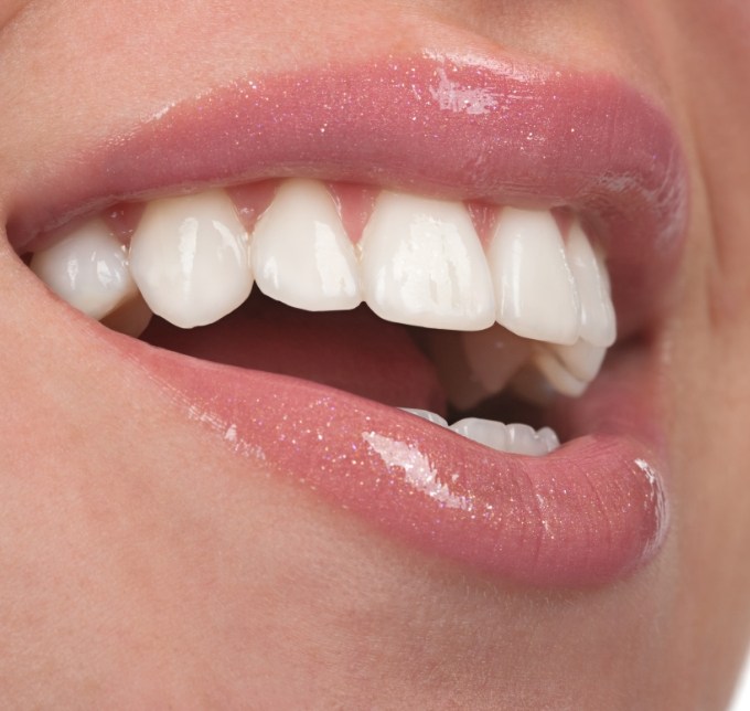 Close up of a mouth smiling and showing teeth