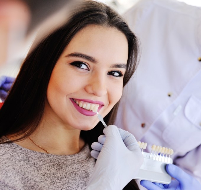 Woman smiling during shade matching process