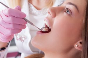 Woman having a dental examination.