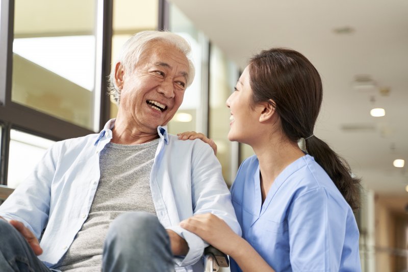 older man in an assisted living facility smiling