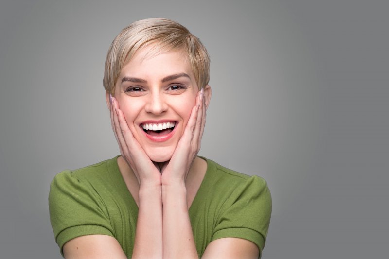 young woman showing off her healthy teeth